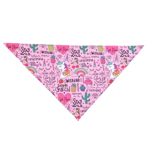 Detailed view of pink pet bandana featuring vibrant unicorn and flamingo cartoon patterns