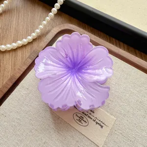 Detailed macro view of the purple gradient flower hair claw clip's acrylic texture