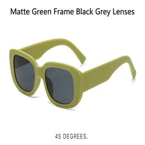 Close-up of matte green sunglasses with dark gray lenses at 45-degree angle