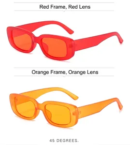 Macro detail view of retro small frame sunglasses in vibrant red and orange colors