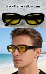 Close-up of retro small frame sunglasses with black frames and yellow lenses