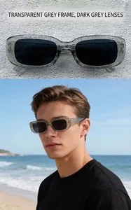 Model wearing retro small frame sunglasses with transparent gray frame and dark lenses