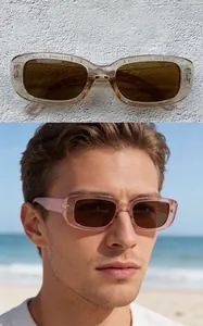 Close-up of retro rectangular sunglasses with champagne frame and tea lenses on model