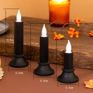 Set di tre candele LED nere con dimensioni di altezza e base visualizzate
