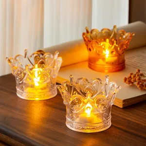Warm glowing LED crown tea lights in elegant transparent crystal-like glass holders