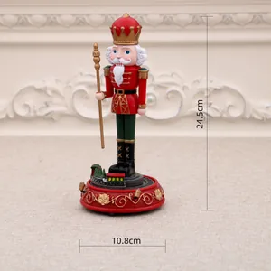 Nutcracker music box figurine showing 24.5cm height and 10.8cm base width dimensions.