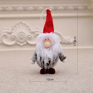 Detailed view of plush Christmas gnome ornament with red knitted hat and white beard