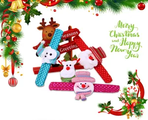 Detailed view of festive Christmas slap bracelets featuring Santa, reindeer and snowman