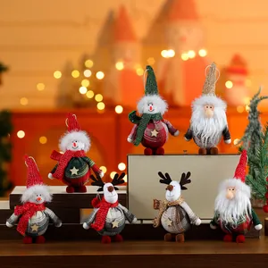 Detailed macro shot of festive fabric Christmas ornaments on a warm bokeh background