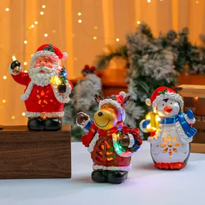 Leuchtendes musikalisches Weihnachtsfiguren-Set aus Harz mit Weihnachtsmann