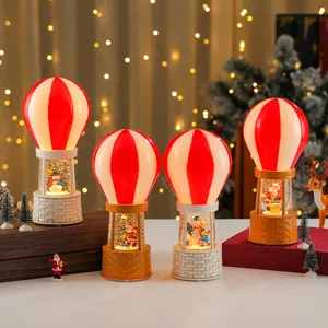 Christmas hot air balloon snow globe music box with LED lights and festive Santa figures