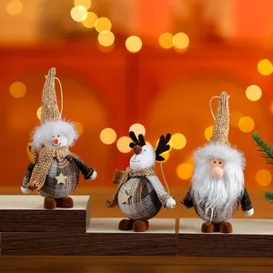 Detailed view of festive plush Christmas ornaments including snowman, reindeer and Santa
