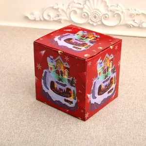 Red Christmas music box packaging featuring Santa and snow house illustrations
