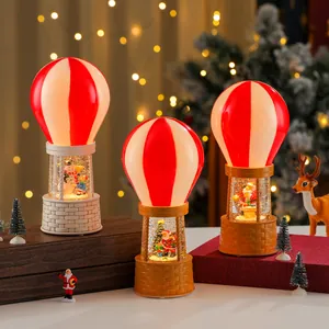 Musical snowing hot air balloon Christmas globes with Santa and snowman scenes