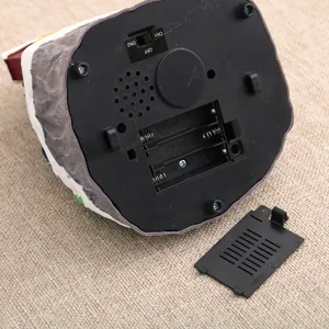 Detail view of the battery compartment and switch on the music box base