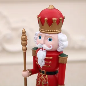Detailed close-up view of a classic red and gold Nutcracker soldier Christmas figurine
