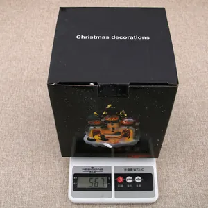 Detail shot of the 567g weight measurement for this luminous Christmas music box ornament