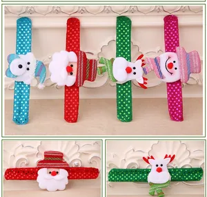 Close-up of festive sequin Christmas slap bracelets with plush Santa and reindeer figures