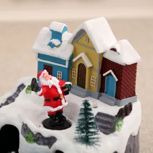 Detailed view of glowing Christmas musical box featuring Santa and snow-covered houses