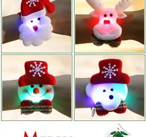 Close-up of glowing Christmas slap bracelets featuring Santa and reindeer characters.