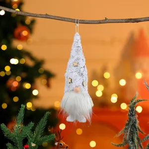 Close-up of white plush Christmas gnome ornament with silver patterned hat