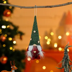 Detailed view of a handmade green and red knitted Christmas gnome hanging ornament