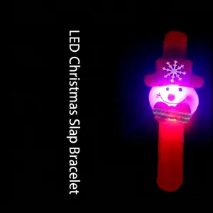 LED glowing Christmas slap bracelet with plush snowman decoration on black background