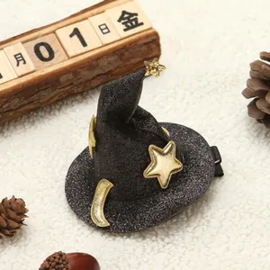 Detail of black glitter witch hat hair clip with gold star and moon for Halloween