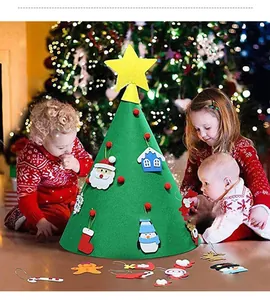 Group of children playing with a DIY felt Christmas tree featuring colorful ornaments