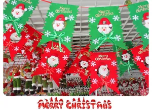 Detail of festive red and green felt Christmas banners with Santa Claus motifs and bows.