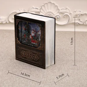 Scatola musicale natalizia a forma di libro con dimensioni 17cm x 14,5cm x 5,7cm. Elegante.