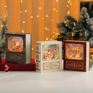 Set di tre lanterne a palla di neve natalizie a forma di libro con luci glitterate