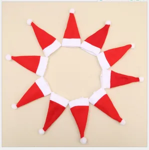 Mini red Santa hats set arranged in a circle for festive Christmas table and bottle decor