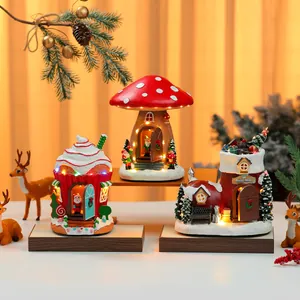 Detailed view of festive light-up resin miniature Christmas houses with musical box features