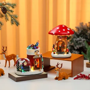 Detailed view of illuminated Christmas resin houses with warm LED lighting