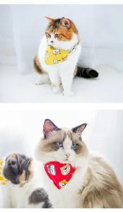 Detailed view of cute pet bandana collars with cartoon prints on two different cats