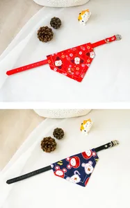 Detailed view of red and navy pet collars with cute lucky cat and mouse print bandanas.