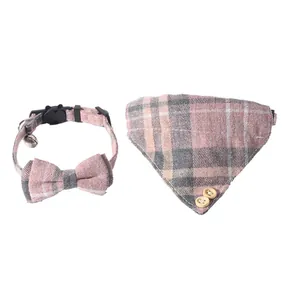Detailed view of the pink British plaid pet cat collar and matching bandana set with bell