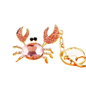 Cute gold-toned crab keychain with pink crystals and rhinestones for car keys and bags
