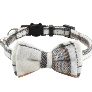 Plaid cat collar with bow tie and bell in classic British style for pets.