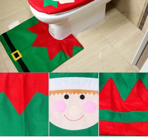 Close-up detail of Christmas elf toilet seat cover set showing felt material and embroidery.