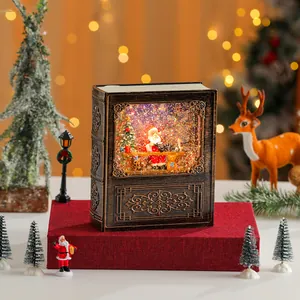 Carillon a palla di neve di Natale in stile libro antico con scena di Babbo Natale