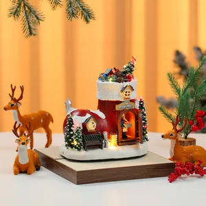 Detailed close-up of a festive Christmas boot music box with LED lights and holiday decor.