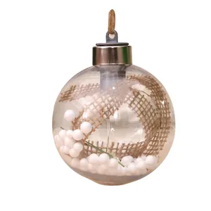Clear plastic Christmas ornament ball with burlap ribbon and white snowballs inside.