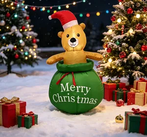 Ours de Noël gonflable dans un sac cadeau vert avec texte Merry Christmas festif