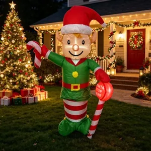 Inflatable Christmas elf holding a candy cane and luminous sign in a decorated yard