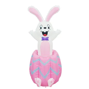 Large inflatable Easter bunny rising from pink chevron egg for holiday outdoor yard decor