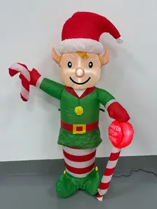Giant inflatable Christmas elf with glowing candy cane and 'Santa Stop Here' sign.