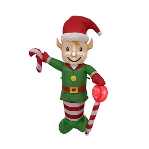 Giant inflatable Christmas elf with candy cane and glowing Santa Stop Here sign for yard