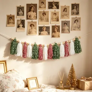 Festive boho Christmas tassel garland with wooden beads hanging on a vintage wall.